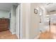 Hallway with hardwood flooring and access to multiple rooms and a bathroom at 1482 Waterford Dr, Zionsville, IN 46077