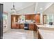 Traditional kitchen with wooden cabinetry, neutral countertops, and a pendant light at 1482 Waterford Dr, Zionsville, IN 46077