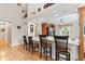 Kitchen counter and bar stool seating connecting to the open-concept living space at 1482 Waterford Dr, Zionsville, IN 46077