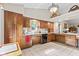 Cozy kitchen with wood cabinets, tile flooring, and great natural light at 1482 Waterford Dr, Zionsville, IN 46077