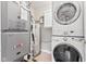 Functional laundry space with stacked washer/dryer and essential utility components at 1482 Waterford Dr, Zionsville, IN 46077
