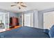 Comfortable bedroom featuring a four-poster bed, ceiling fan, and access to additional rooms at 1482 Waterford Dr, Zionsville, IN 46077