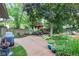 Paver patio with outdoor seating, a lush garden, and privacy fencing for serene relaxation at 1482 Waterford Dr, Zionsville, IN 46077