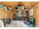 Well lit and organized interior of the storage shed with windows and an array of storage items at 1482 Waterford Dr, Zionsville, IN 46077