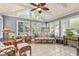 Bright sun room with ceiling fan, a vaulted ceiling, and many windows at 1482 Waterford Dr, Zionsville, IN 46077