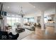 Spacious open-concept living room that showcases an elegant design and flows into the dining and kitchen areas at 15926 Bellows Ave, Fishers, IN 46040