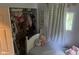 A bedroom featuring decor, a bed with stuffed animals, and a window at 162 W Robertson Rd, Morgantown, IN 46160