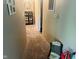 A view of a hallway with neutral walls and flooring, leading to rooms in the home at 162 W Robertson Rd, Morgantown, IN 46160
