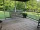Relax on this spacious porch with a swing, surrounded by serene wooded views at 162 W Robertson Rd, Morgantown, IN 46160
