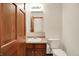 Cozy bathroom with a vanity, toilet, mirror and a wood door, offering a functional space at 177 Jacinta Pl, Bargersville, IN 46106