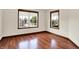Cozy bedroom with hardwood floors, offering two windows that provide ample natural light and a pleasant view at 177 Jacinta Pl, Bargersville, IN 46106
