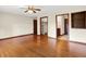 Spacious bedroom featuring hardwood floors, ceiling fan, and ample closet space at 177 Jacinta Pl, Bargersville, IN 46106