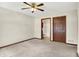 Bright bedroom with neutral walls and carpet, ceiling fan, and ensuite bathroom at 177 Jacinta Pl, Bargersville, IN 46106