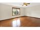 Bright bedroom featuring a large window, hardwood floors, and a ceiling fan at 177 Jacinta Pl, Bargersville, IN 46106