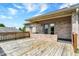 A spacious wooden deck is attached to a brick home offering a relaxing outdoor space with a sliding glass door at 177 Jacinta Pl, Bargersville, IN 46106