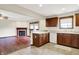 Kitchen and living room showcase an open layout with breakfast bar seating, perfect for casual entertaining at 177 Jacinta Pl, Bargersville, IN 46106