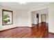 Bright room showcasing hardwood floors and natural light from a large window, creating a welcoming atmosphere at 177 Jacinta Pl, Bargersville, IN 46106