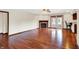 Inviting living room features a cozy fireplace, ceiling fan, and elegant hardwood floors, perfect for relaxation at 177 Jacinta Pl, Bargersville, IN 46106