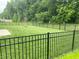 Fenced backyard showcasing a lush green lawn and privacy, ideal for relaxation and recreation at 213 Drewood Dr, Trafalgar, IN 46181