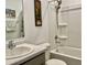 Bathroom with a sink and vanity and a bathtub and shower with adjustable shower head at 213 Drewood Dr, Trafalgar, IN 46181