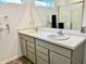 Clean and updated bathroom featuring a double sink vanity with chrome fixtures and a large mirror at 213 Drewood Dr, Trafalgar, IN 46181