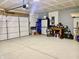Well-organized garage with storage units, workbench, and tools, providing functionality and convenience at 213 Drewood Dr, Trafalgar, IN 46181