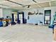 Spacious garage with ample storage, organized shelving, and a clean, well-lit interior at 213 Drewood Dr, Trafalgar, IN 46181
