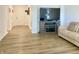 Comfortable living room with hardwood floors, a fireplace, and neutral decor at 213 Drewood Dr, Trafalgar, IN 46181