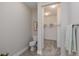 Half bathroom with neutral walls, toilet, towel rack, and partial view into a walk-in closet at 2169 Aviary Ln, Danville, IN 46122