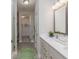 Bathroom features a double vanity, walk-in shower, and a view into the walk-in closet at 2169 Aviary Ln, Danville, IN 46122