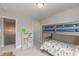 bedroom with bunk beds, storage, and neutral walls, creating a functional and inviting space at 2169 Aviary Ln, Danville, IN 46122