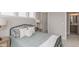 Bright bedroom featuring neutral walls, black metal bed frame, and view into the ensuite bathroom at 2169 Aviary Ln, Danville, IN 46122