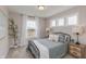 Bedroom featuring neutral walls, a comfortable bed, and plenty of natural light from the window at 2169 Aviary Ln, Danville, IN 46122