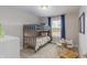 bedroom featuring a bunk bed, a small table with chairs, and plenty of natural light at 2169 Aviary Ln, Danville, IN 46122