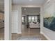 Hallway showing natural light, wood-look flooring, neutral paint, and views of the living spaces at 2169 Aviary Ln, Danville, IN 46122