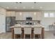 Modern kitchen boasts stainless steel appliances, light wood cabinets, and a large island with seating at 2169 Aviary Ln, Danville, IN 46122