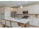 Well-appointed kitchen showcases stainless steel appliances and a center island with barstool seating at 2169 Aviary Ln, Danville, IN 46122