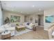 Bright living room with views to the dining and kitchen area, neutral colors, and stylish decor at 2169 Aviary Ln, Danville, IN 46122