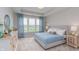 Serene main bedroom with a large bed, dresser, and window offering scenic views at 2169 Aviary Ln, Danville, IN 46122