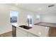 Modern kitchen with an island and stainless steel appliances, with views to the outside at 2227 Foothill Dr, Greenfield, IN 46140