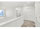 Well-lit upstairs hallway featuring neutral carpeting and white trim at 2227 Foothill Dr, Greenfield, IN 46140