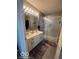 Modern bathroom featuring a double vanity with white cabinets and a sleek, glass-enclosed shower at 2231 Abbey St, Brownsburg, IN 46112