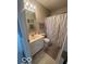 Cozy bathroom features a neutral-toned shower curtain and a well-lit vanity area at 2231 Abbey St, Brownsburg, IN 46112