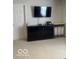 Well-lit bedroom offering ample storage with a sleek black dresser and functional design at 2231 Abbey St, Brownsburg, IN 46112