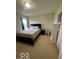 Bedroom featuring a bed, side table, and white bookcase, bathed in natural light at 2231 Abbey St, Brownsburg, IN 46112