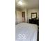 Bedroom featuring a dresser with mirror and white bedding, under natural light at 2231 Abbey St, Brownsburg, IN 46112
