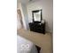 Bedroom featuring a dresser with mirror and white bedding, under natural light at 2231 Abbey St, Brownsburg, IN 46112