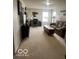 Upstairs bonus room is cozy and complete with a sofa, desk and chair at 2231 Abbey St, Brownsburg, IN 46112