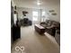 Upstairs bonus room is cozy and complete with a sofa, desk and chair at 2231 Abbey St, Brownsburg, IN 46112