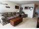 Bonus room featuring comfortable sofa, chair, and baseball decorations at 2231 Abbey St, Brownsburg, IN 46112